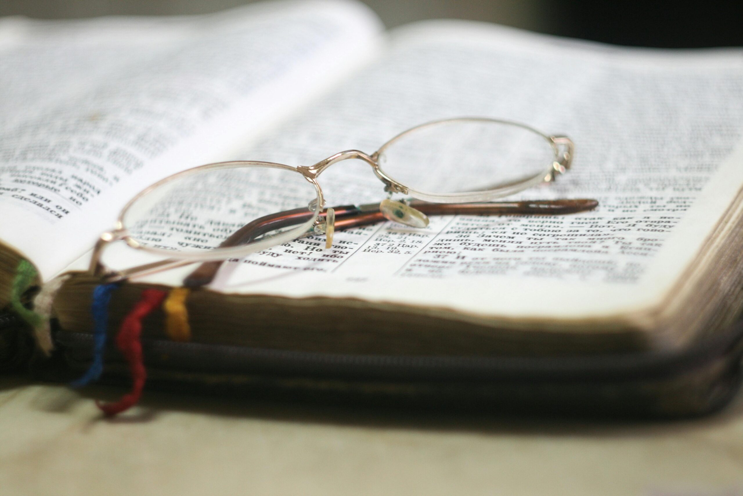 Bible with glasses on it