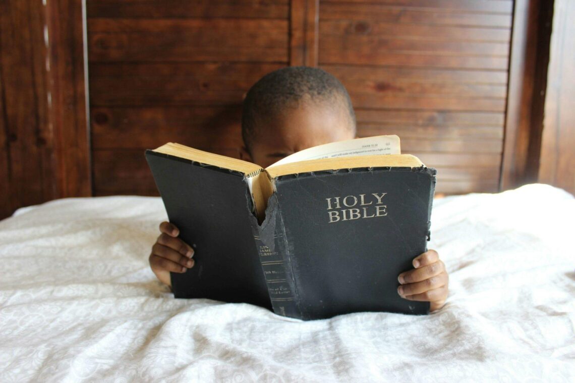 child reading the bible