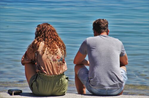 a couple sitting at the beach