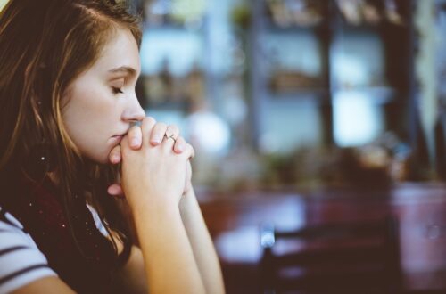 a woman praying in church