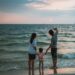 family hanging out at the beach