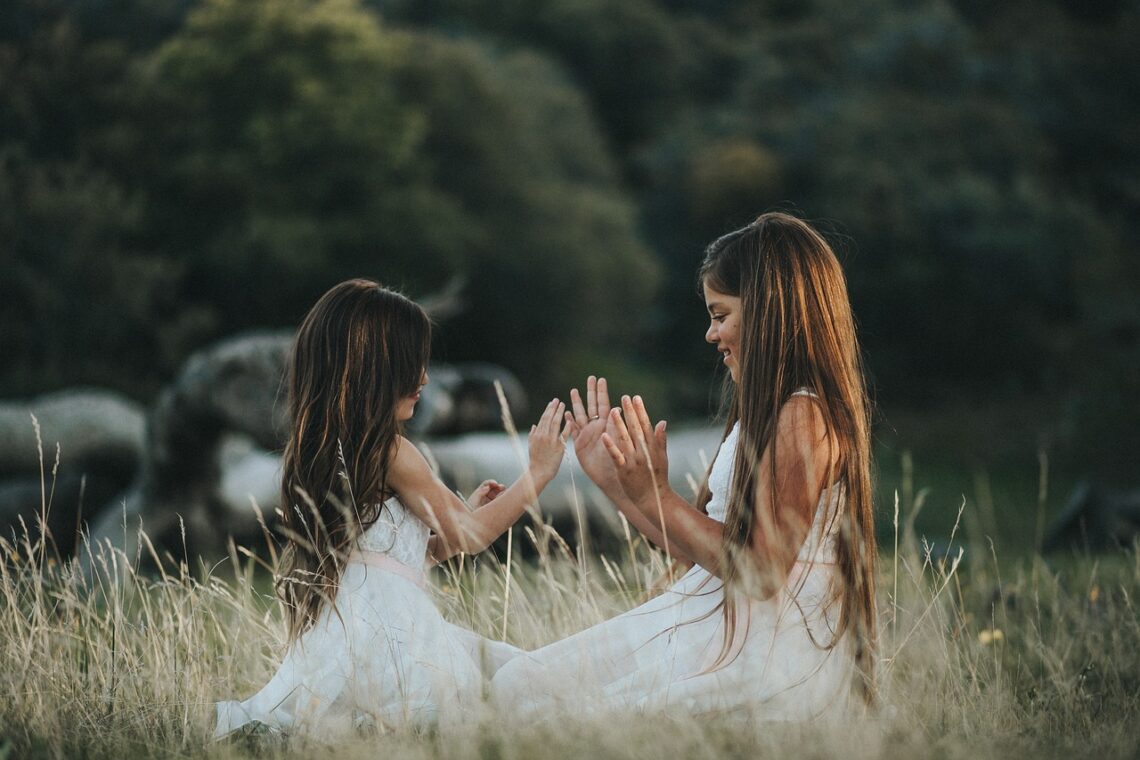 two girl friends playing outside