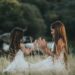 two girl friends playing outside